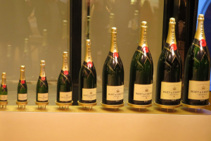 Stare at the different bottle sizes of Champagne Mumm during our Champagne private wine tour.