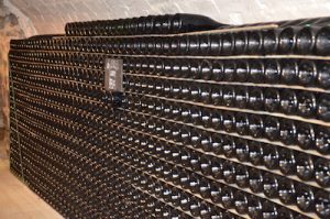 Bottles of champagne ageing in cellar, The greatest players of Champagne's history