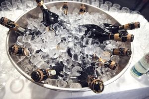 bottles of champagne in ice before the service, The greatest players of Champagne's history